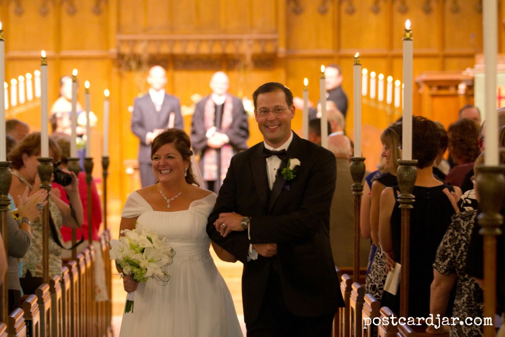 Smiling all the way down the aisle! Photo by Aaron Babcock