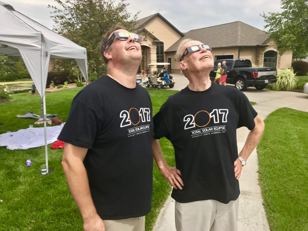Steve and his dad, John Teget, watch the total solar eclipse from our front yard in Crete, Nebraska.