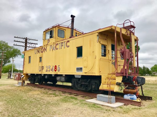A Union Pacific caboose is situated in the museum village.