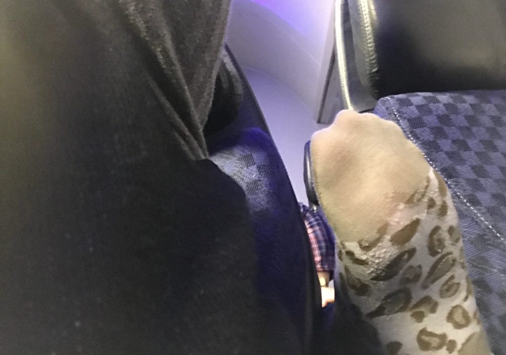 The lady behind us put her dirty sock covered foot right between our seats! 