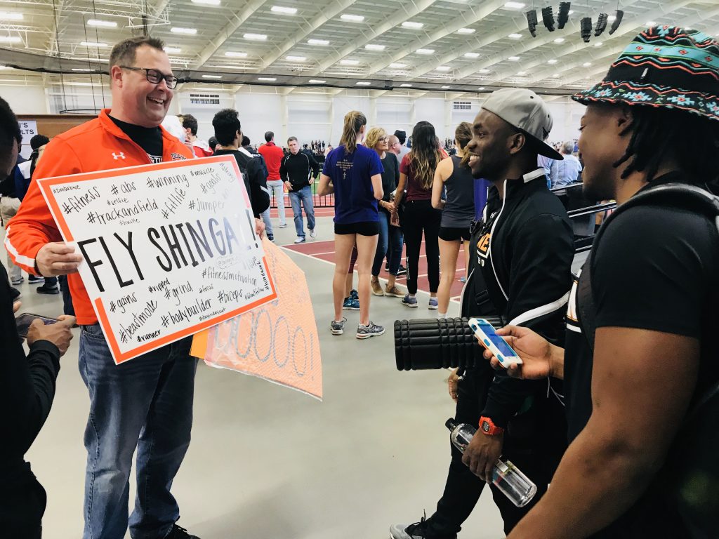Showing the guys the signs we made to cheer them on at the NAIA National Track and Field Championships in Pittsburg, Kansas