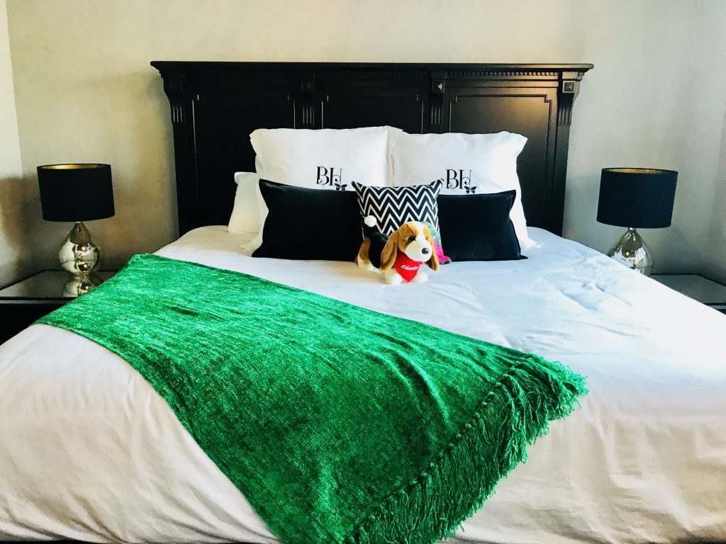 Each room at The Pioneer Woman Boarding House has luxurious bedding, an accent blanket, and a stuffed animal from The Mercantile.