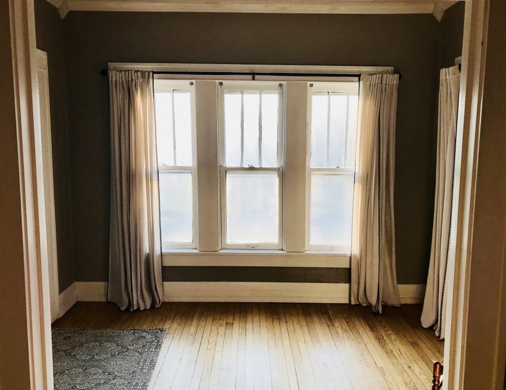 We love the bright entryway that the front door opens into. Not sure exactly what we're going to do with this space yet, but Ann is already picturing a Christmas tree in the window. 