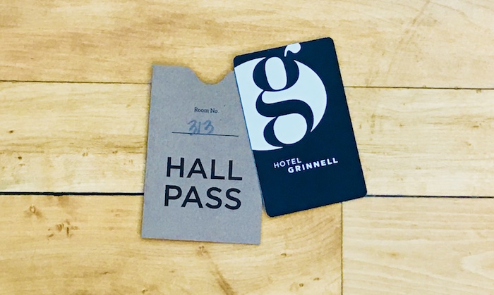 Hotel guests are given their room keys in a "hall pass" sleeve as a nod to the building's history as a school. 