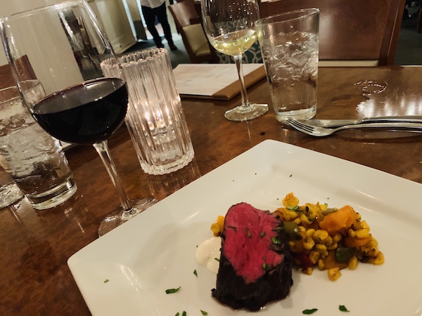 Red wine poached beef tenderloin with butternut squash succotash. 