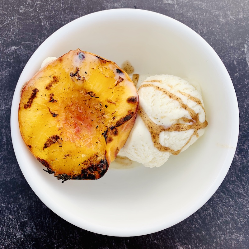 Grilled peach with ice cream