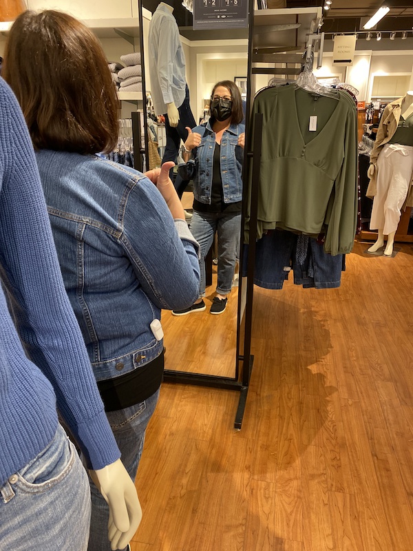 Trying on a jean jacket